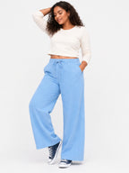 Women Sky Blue Solid Wide Leg Drawstring Palazzo Pants | PLATO